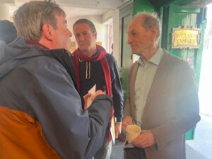 Bryan Coyle speaking with Mark Thomas and Sir Michael Marmot before filming of a new BBC documentary on the NHS - 80 years on