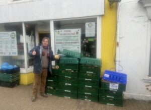 Bryan Coyle outside East Brighton Food Co-op with lots of fresh surplus vegetables, ready for redistribution to other food groups and to be cooked up in the EBFC klitchen for meals on wheels for the elderly.